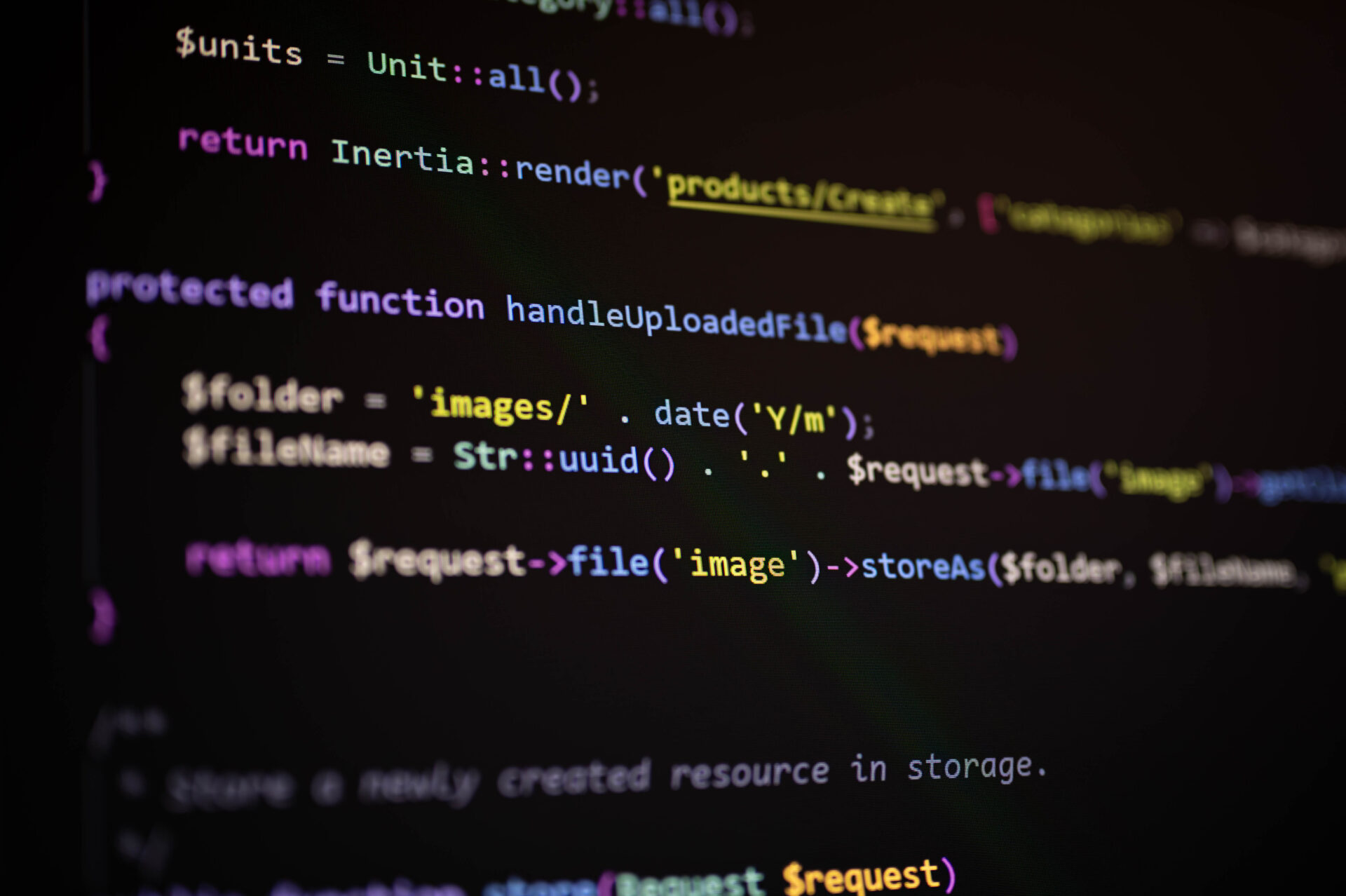 close up of php laravel code in a function handling file uploads and dynamic folder creation, showcasing back end programming, data storage, and modern web application development.